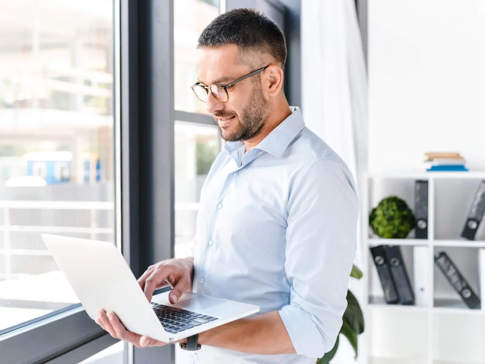 man with laptop in hand